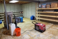 flooded basement being dried out by equipment