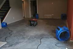 equipment in use to dry out basement